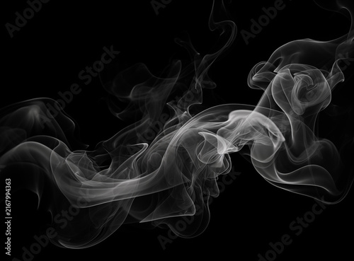 Fotografía Swirling white smoke plumes elegantly rise against black creating unique abstract visual designs for graphic arts and decorative purposes