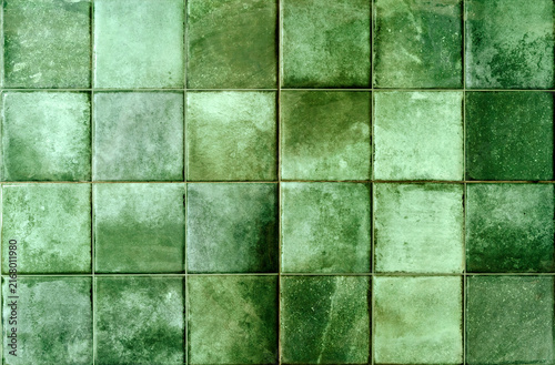 Green ceramic tile background. Old vintage ceramic tiles in green to decorate the kitchen or bathroom