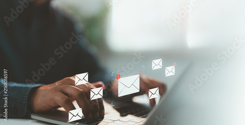Close-up hand of A Businessman working on a laptop open an email for notification error and maintenance concept, network security, computer virus detected, personal data protection.