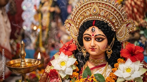 Durga Puja Goddess Durga Idol with Lotus, Hibiscus and Traditional Bengali Floral Decorations