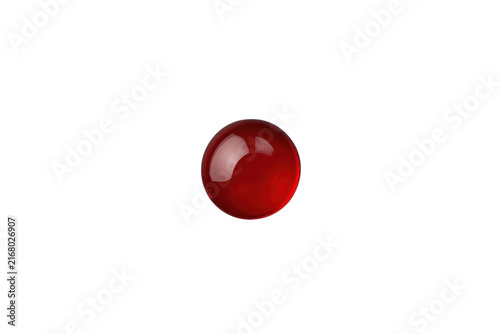 Small glossy red spherical liquid drop
