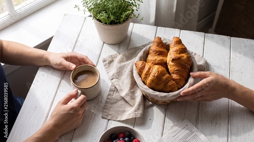 Freshly baked croissants and coffee for morning breakfast