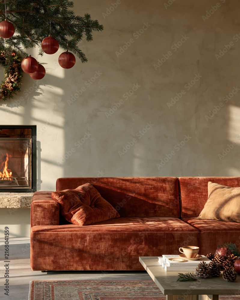 Naklejka premium Cozy living room with a plush terracotta sofa and decorated pine branch, featuring a glowing fireplace for seasonal home decor and lifestyle marketing