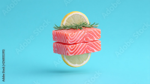 Fresh salmon fillet stack with lemon slices and rosemary on blue background raw fish rosemary sprig