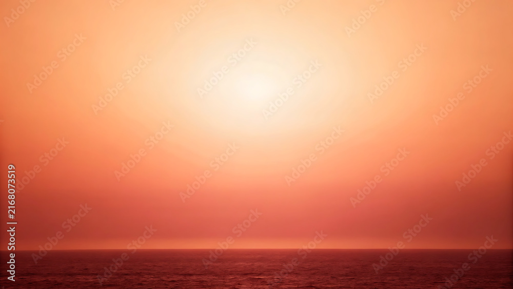 Obraz premium Dramatic ocean sunrise with golden horizon glow and serene minimalist seascape view