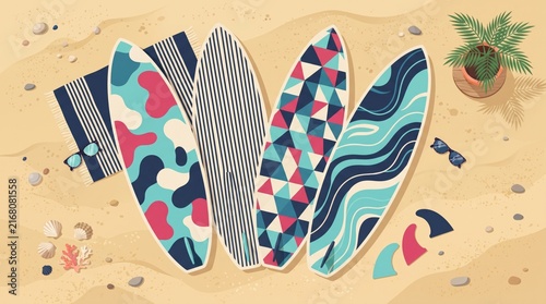 Colorful surfboards on a sandy beach with a small potted plant nearby