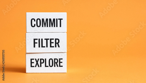 Naklejka Commit filter explore concept with stacked white blocks on orange background representing decision making process