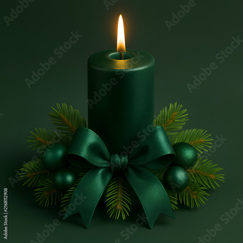Elegant dark green Christmas candle with glowing flame, fir branches, bow, and copy space