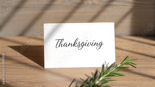 Handwritten Thanksgiving place card on rustic wooden table for festive holiday dinner setting