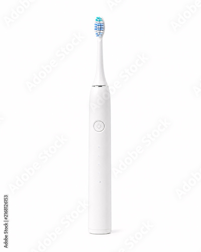 Modern white electric toothbrush on isolated background