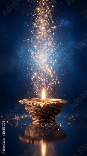 Golden diya lamp with sparkling light trail a traditional oil lamp for celebration and religious ceremonies