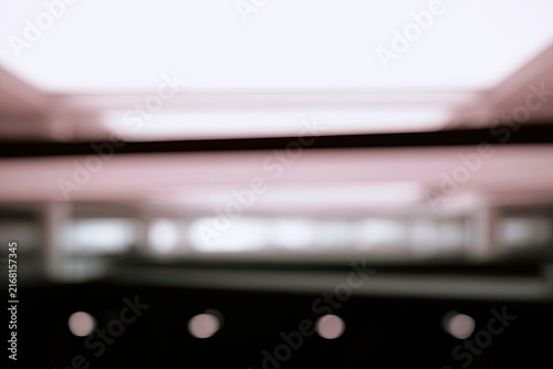 Softly lit, out-of-focus interior architecture with glowing circles