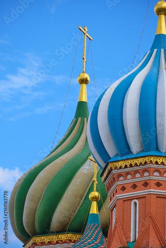 Canvas Print Ornate onion domes and golden crosses on a historic Russian Orthodox church of Saint Basils Cathedral against a blue sky