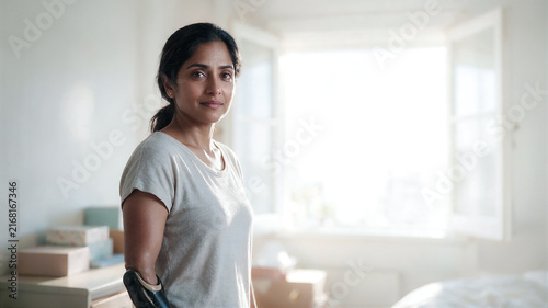Packing up and moving new place and new opportunities, adult woman South Asian descent with prosthetic arm packing things boxes, legal consultations and copy space text about divorce lawyer services