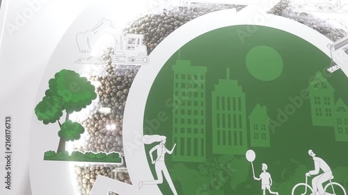 Environmental exhibit panel showing green circular emblem with white urban skyline and recreational pictograms, with environment, sustainability, green, graphic detail