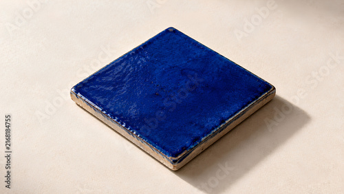 Single Cobalt Blue Ceramic Tile With Handmade Texture and Soft Natural Light