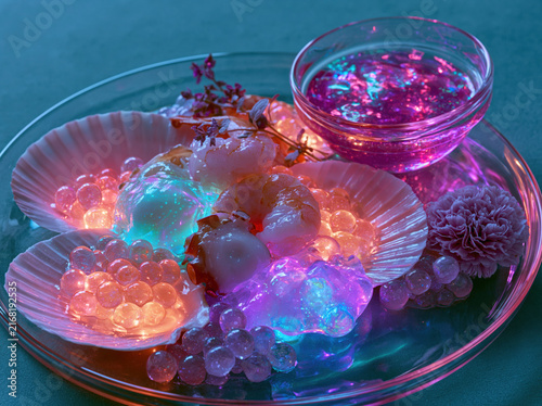 Alien-inspired seafood platter, year 2100, bioluminescent shellfish, transparent edible pearls, holographic sauces, futuristic luxury dining, hyper realistic gourmet food photography.