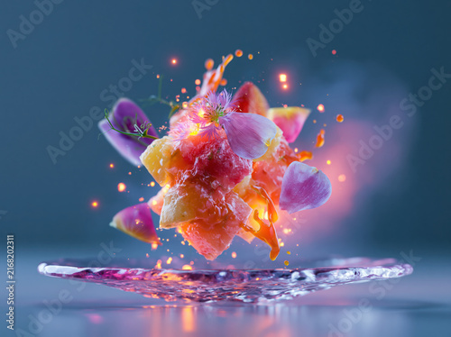 An anti-gravity dessert floating above a crystal plate, colorful fruit petals orbiting around it, liquid caramel suspended in mid-air, glowing edible flowers, ultra-realistic gourmet photography