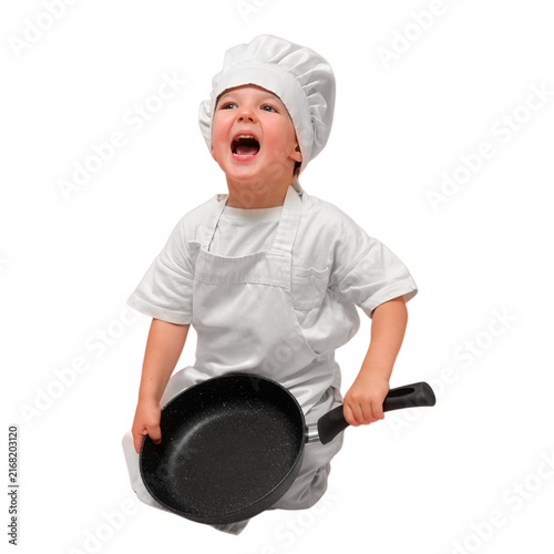 Bild auf Leinwand Happy child dressed as chef wearing white hat and apron holding frying pan