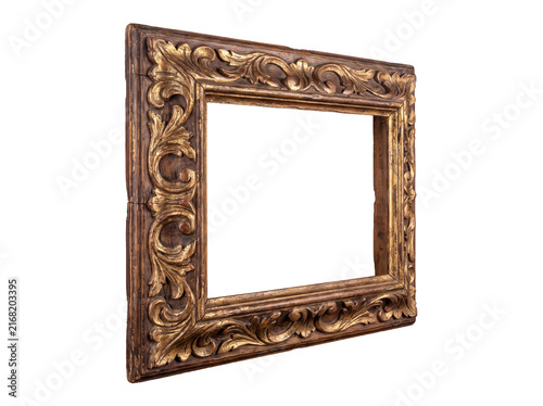 Ornate antique wooden picture frame with detailed gold-leaf carving, viewed from an angle on a transparent background.