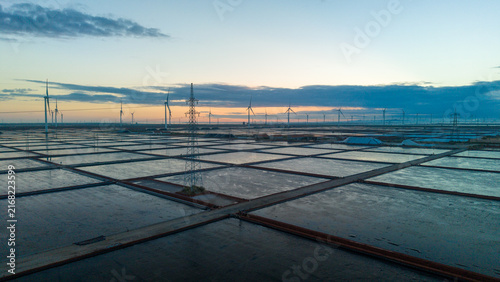 Salt Ponds and Wind Turbines at Dusk Landscape