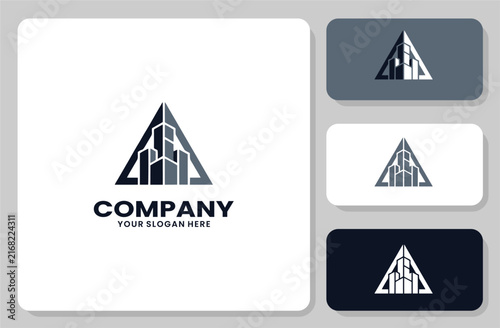 Triangle Real Estate Logo Design with Modern Skyscraper Building Icon for Construction Firm