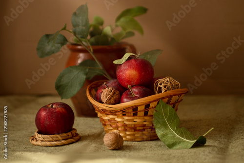 Natural background: red apples in a woven basket for making a pie