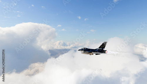 A military fighter jet flying through clouds with afterburner blazing