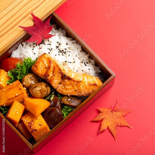 Traditional Japanese Autumn Bento Box with Maple Leaf Isolated