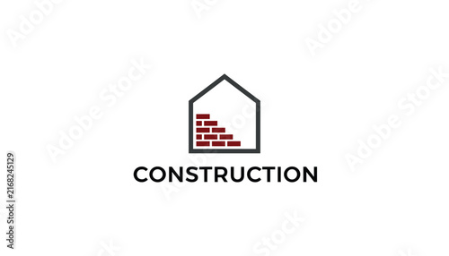 Minimalist construction and real estate company logo featuring brick wall inside a house icon on plain white background.
