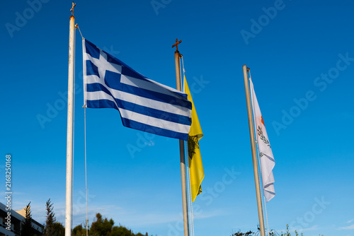 Konstfotografi Flags of Greece, the Greek Orthodox Church, and the Republic of Cyprus near Saint Nicholas Church in Paphos