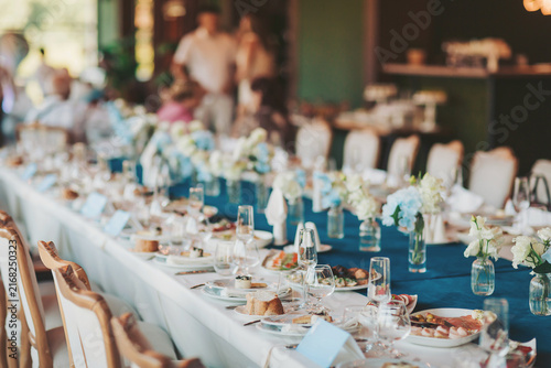 Wedding served banquet table with cold, hot appetizers. table with snacks, catering for a wedding. various snacks and drinks at the buffet table at the corporate catering event