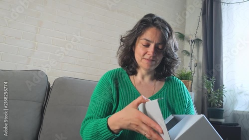 Woman opens delivery box at home and discovers special gift inside
