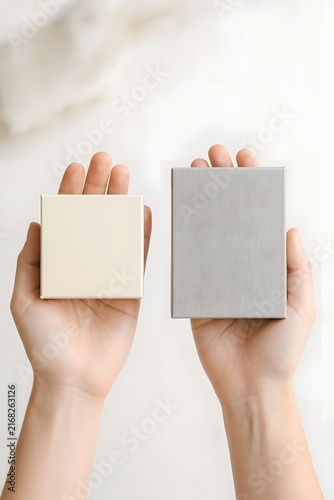 Hands holding empty minimalist paper card templates mockup.