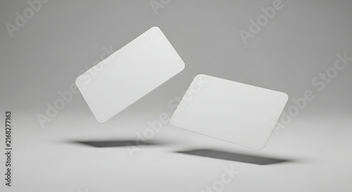 Two Blank Business Cards Floating in a Minimalist Setting.