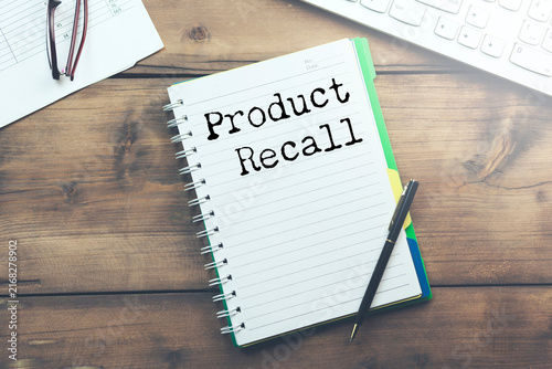 Canvas Print A notebook with product recall text