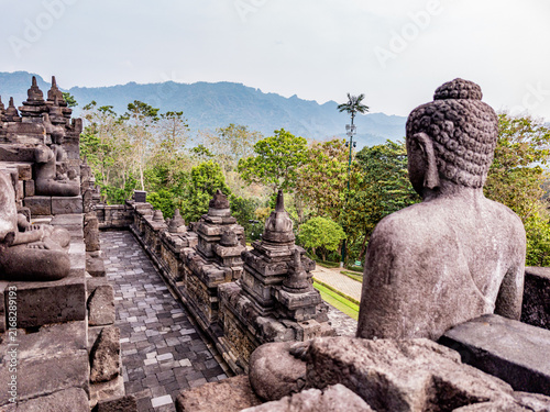 Canvastavla Ancient stone Buddha statues sitting on the terraces of Borobudur temple