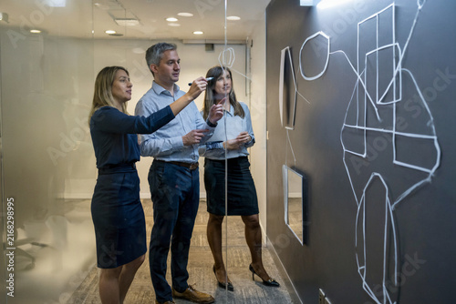 Professional Team Collaborating on Strategy in a Modern Office