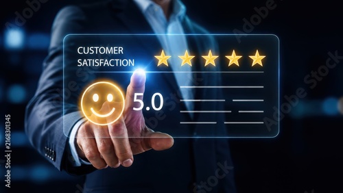 Businessman touching a digital interface showing five star customer satisfaction rating.