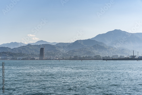 Scenic view of the sea bay and misty mountains on the horizon in Batumi, Georgia