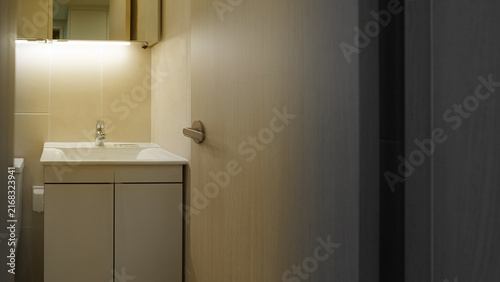 Inviting Warm Glow from Bathroom with Door Ajar