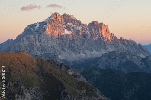Konstfotografi Factual high alpine peak with orange alpenglow lighting in the Dolomites, Italy