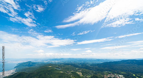Canvas Print Panoramic aerial view of Beppu city and Beppu bay under blue sky with clouds fro