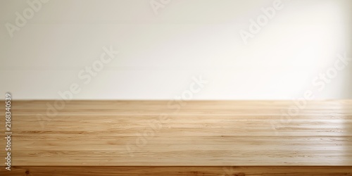 A plain wooden surface extends across the foreground, contrasting with a light, blank wall