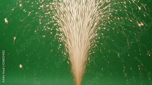 Golden Sparks Bursting Upwards Against Green Screen with Soft Focus and Cinematic Motion