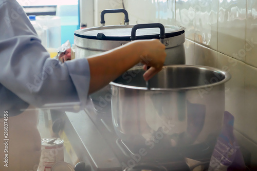 Close up Image of Woman preparing food at the stove