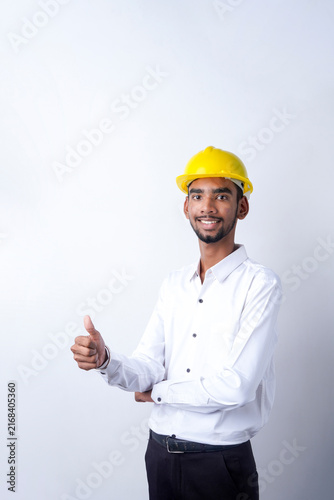 Fotografie Young indian male engineer showing thumps up