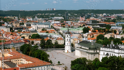 Aerial view of Vilnius cathedral square with bell tower, cobblestone streets and surrounding rooftops, lithuania travel content, heritage tourism marketing, city guide photography, drone stock imagery