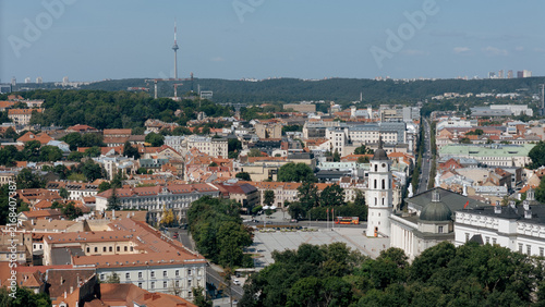 Aerial crop of Vilnius old town bell tower and red rooftops with the TV tower on the horizon, lithuania tourism content, church landmark photography, drone photography stock, travel blog imagery