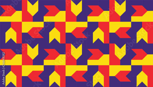 Abstract colorful geometric seamless pattern with yellow, red, and purple arrow shapes for background, modern textile, or packaging design.